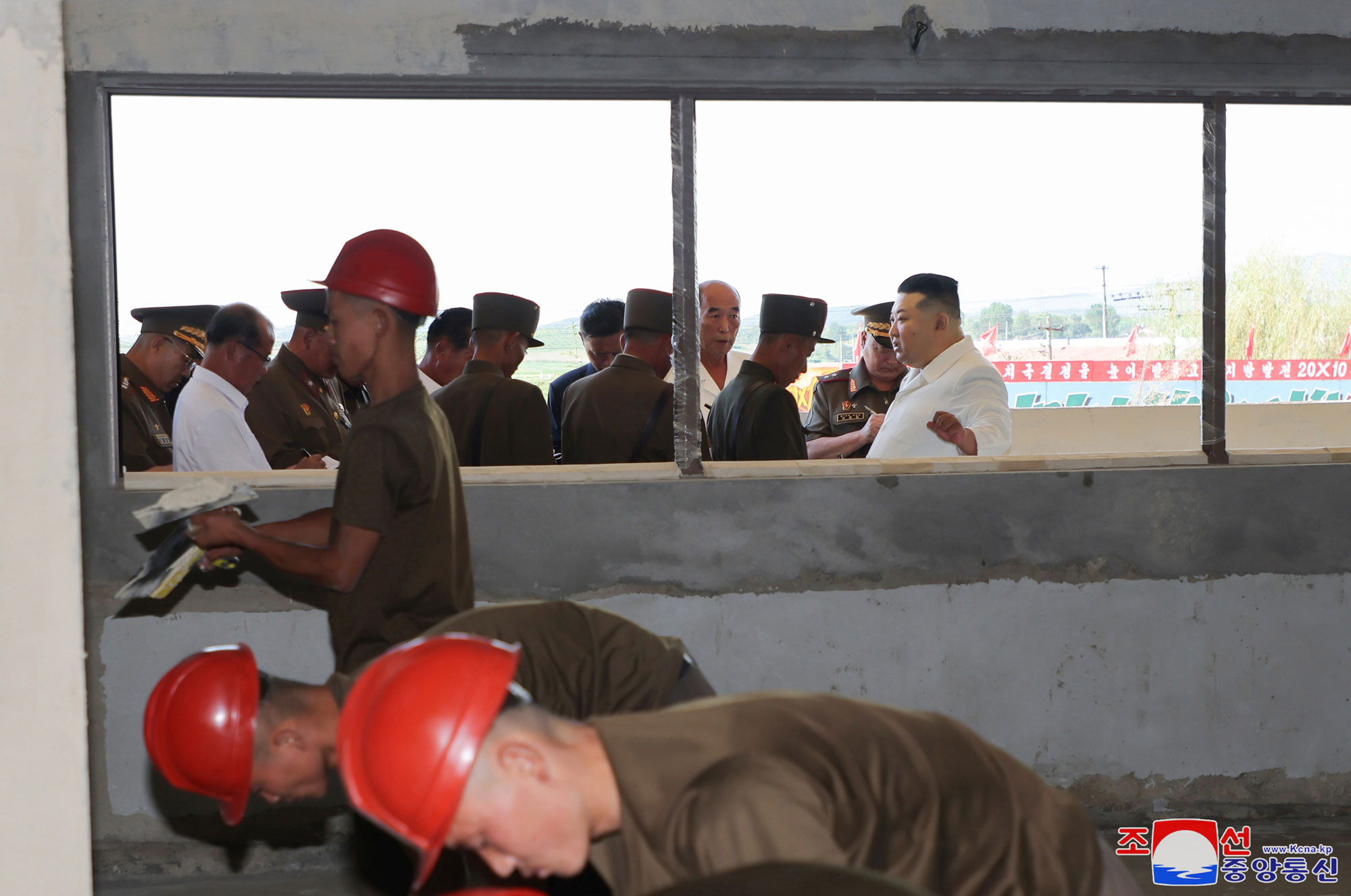 President of State Affairs Kim Jong Un gives field guidance at regional-industry factories under construction in 
Hamju County