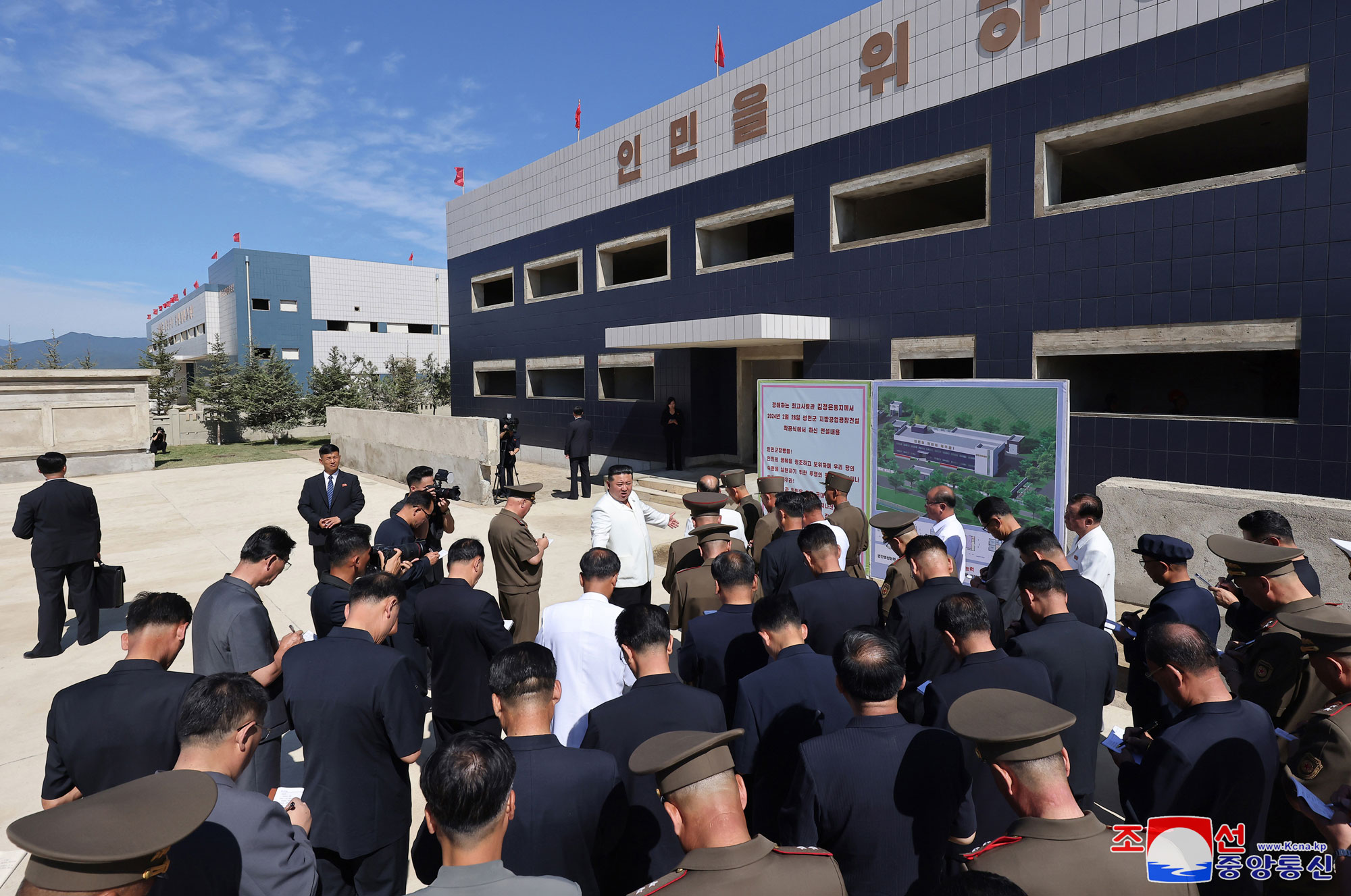 President of State Affairs Kim Jong Un gives field guidance at regional-industry factories under construction in 
Hamju County