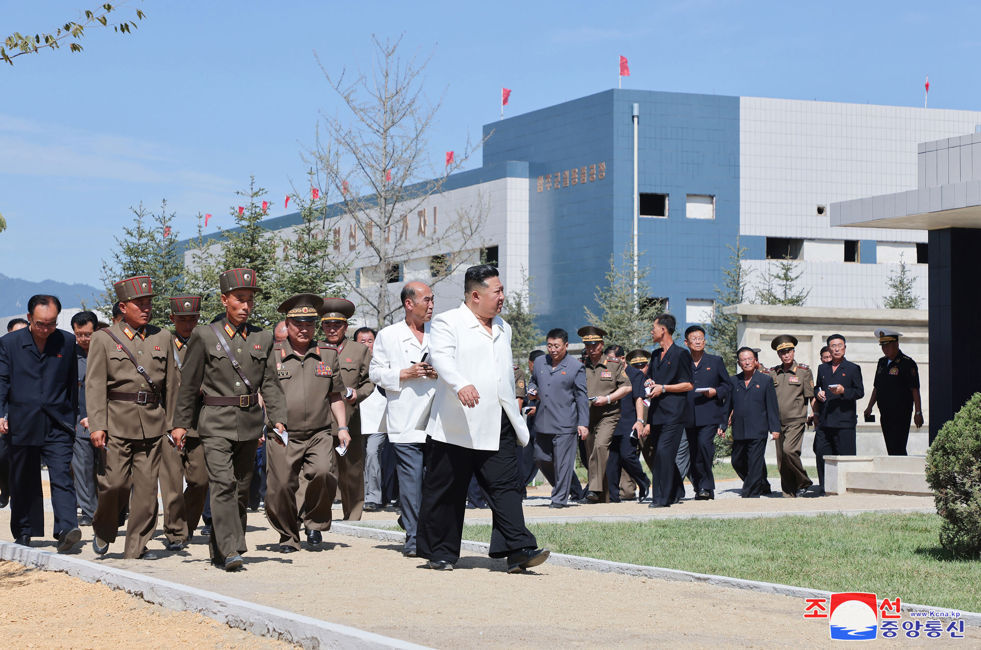 President of State Affairs Kim Jong Un gives field guidance at regional-industry factories under construction in 
Hamju County