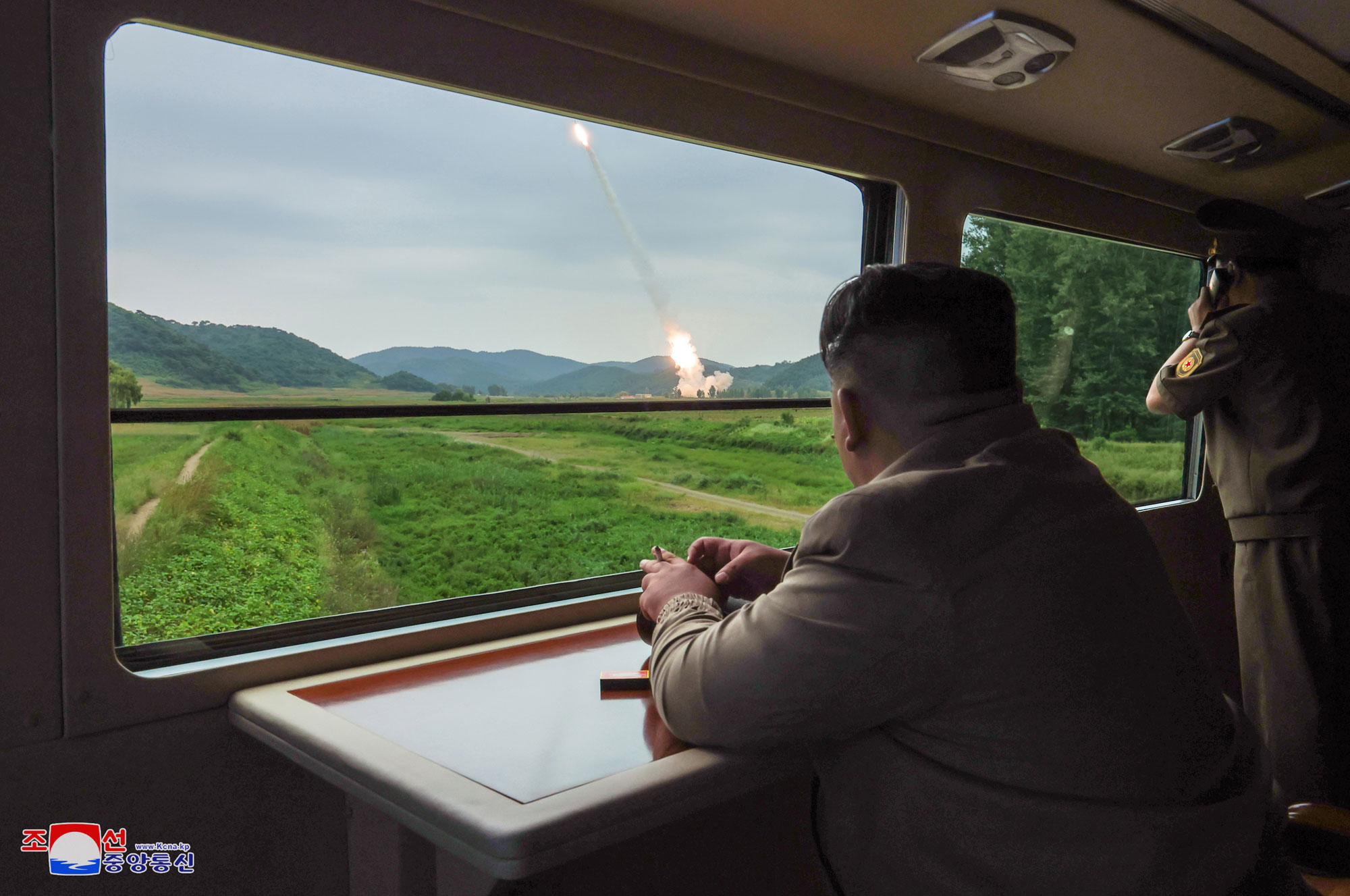 President of State Affairs Kim Jong Un oversees test-fire for verifying performance of new-type 600mm multiple rocket launcher
