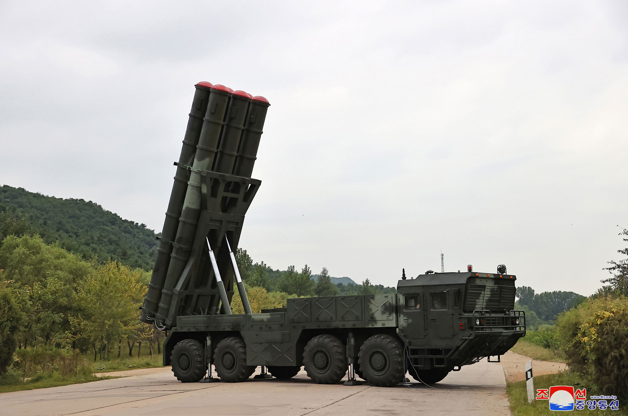 President of State Affairs Kim Jong Un oversees test-fire for verifying performance of new-type 600mm multiple rocket launcher
