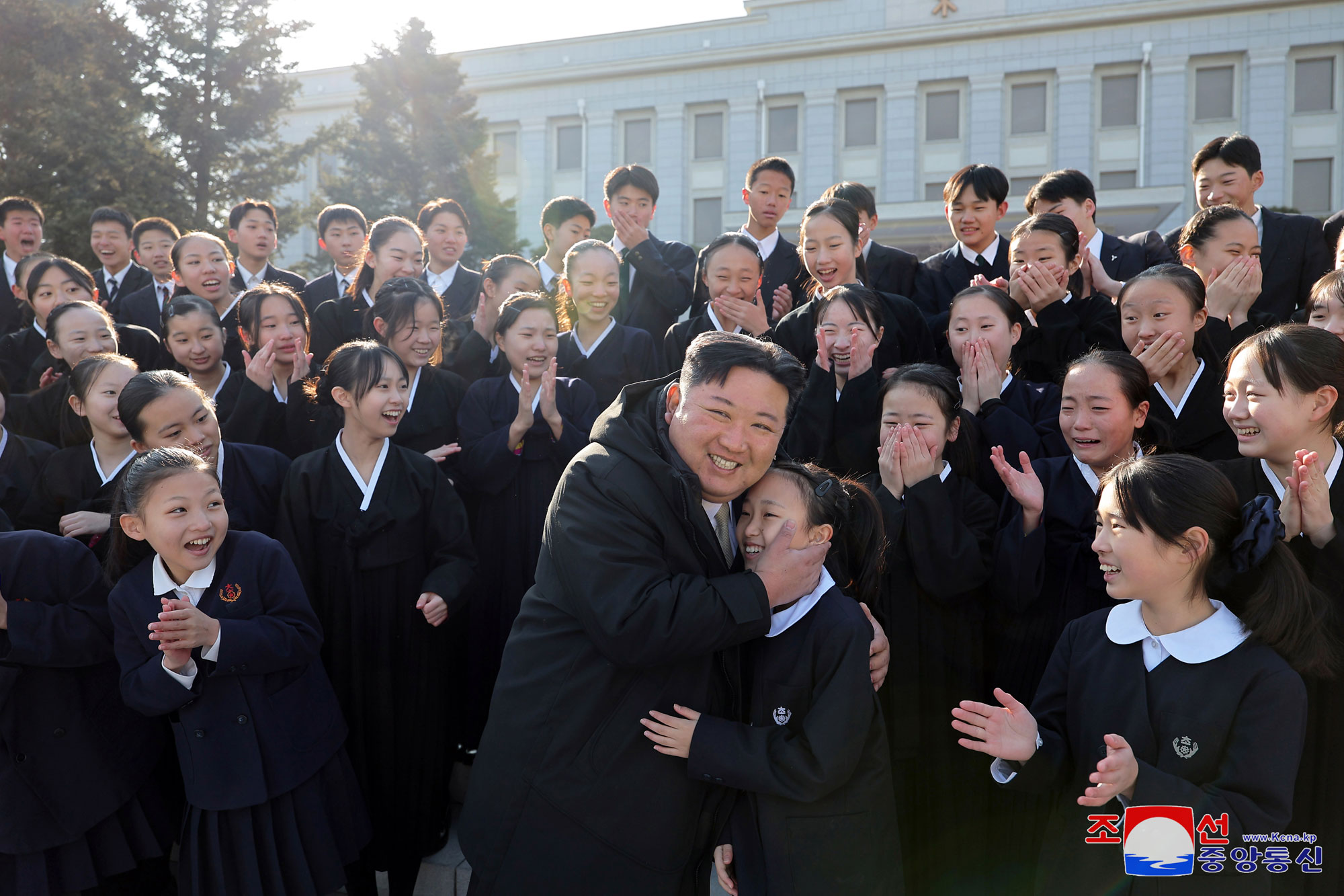President of State Affairs Kim Jong Un meets members of art troupe of Korean schoolchildren in Japan