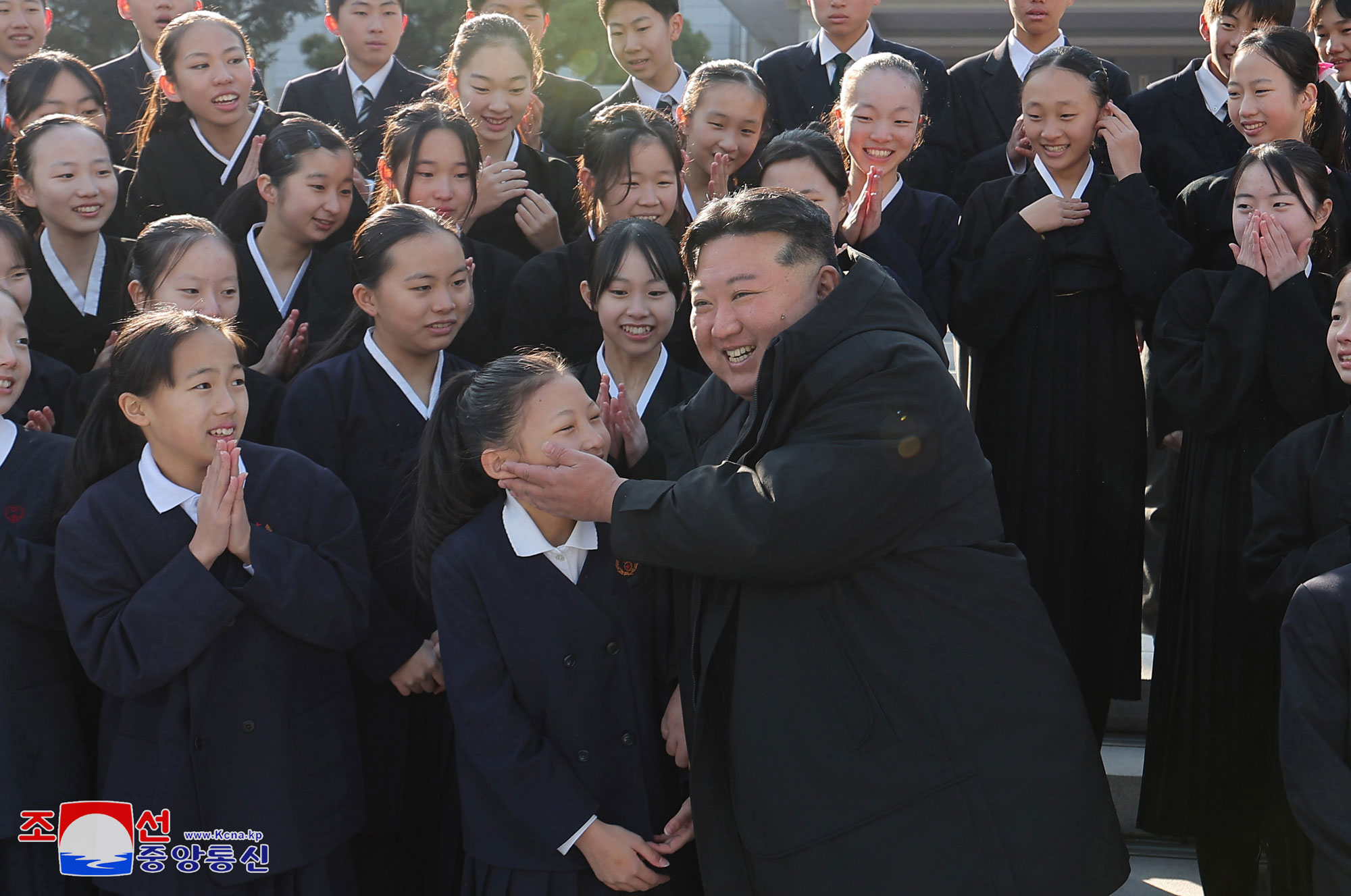 President of State Affairs Kim Jong Un meets members of art troupe of Korean schoolchildren in Japan