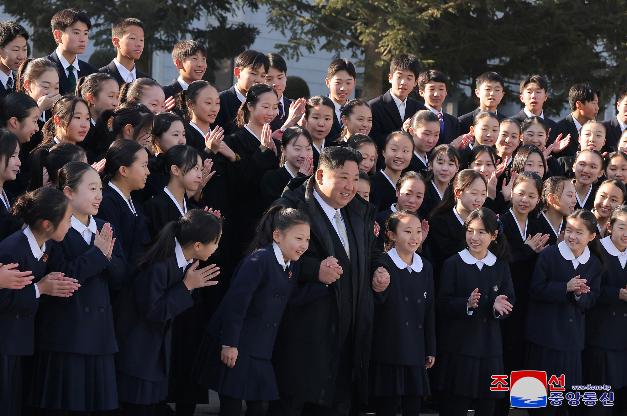 President of State Affairs Kim Jong Un meets members of art troupe of Korean schoolchildren in Japan