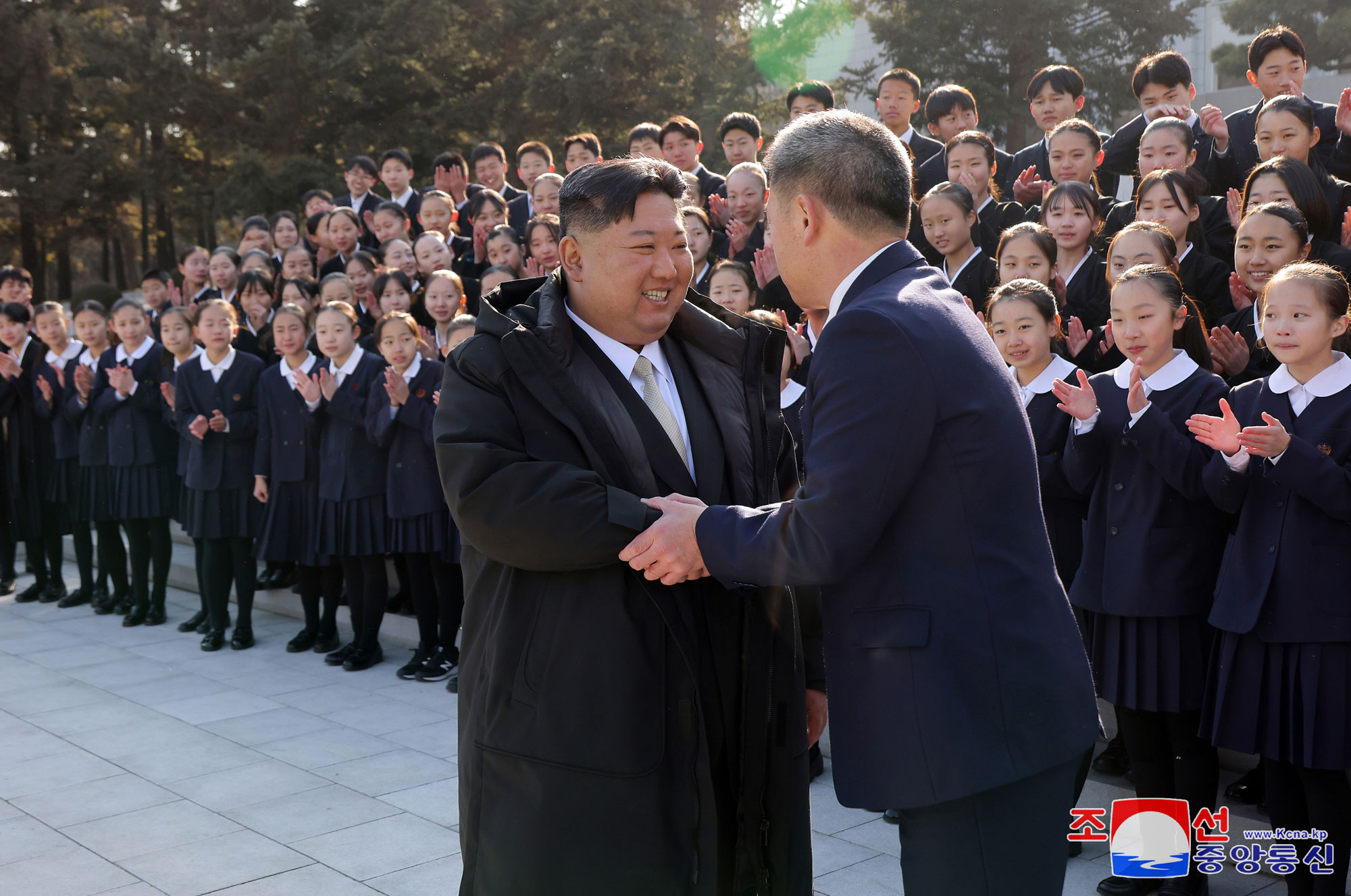 President of State Affairs Kim Jong Un meets members of art troupe of Korean schoolchildren in Japan