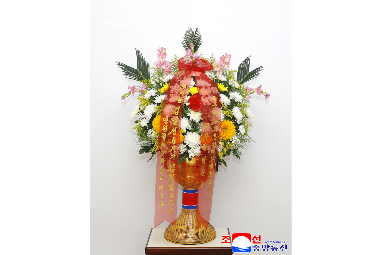 Floral baskets sent to bronze statues of great leaders Kim Il Sung and Kim Jong Il