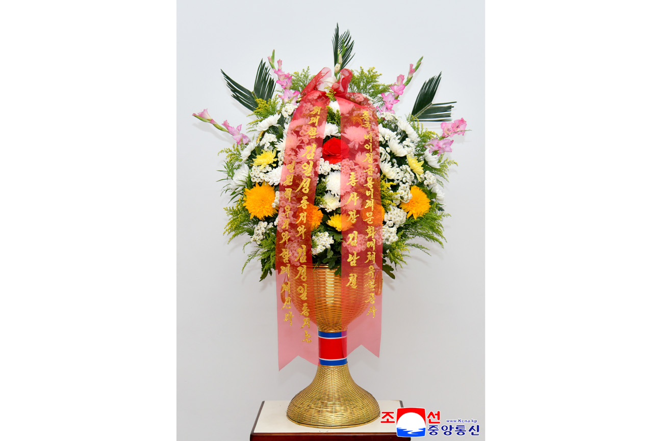 Floral baskets sent to bronze statues of great leaders Kim Il Sung and Kim Jong Il