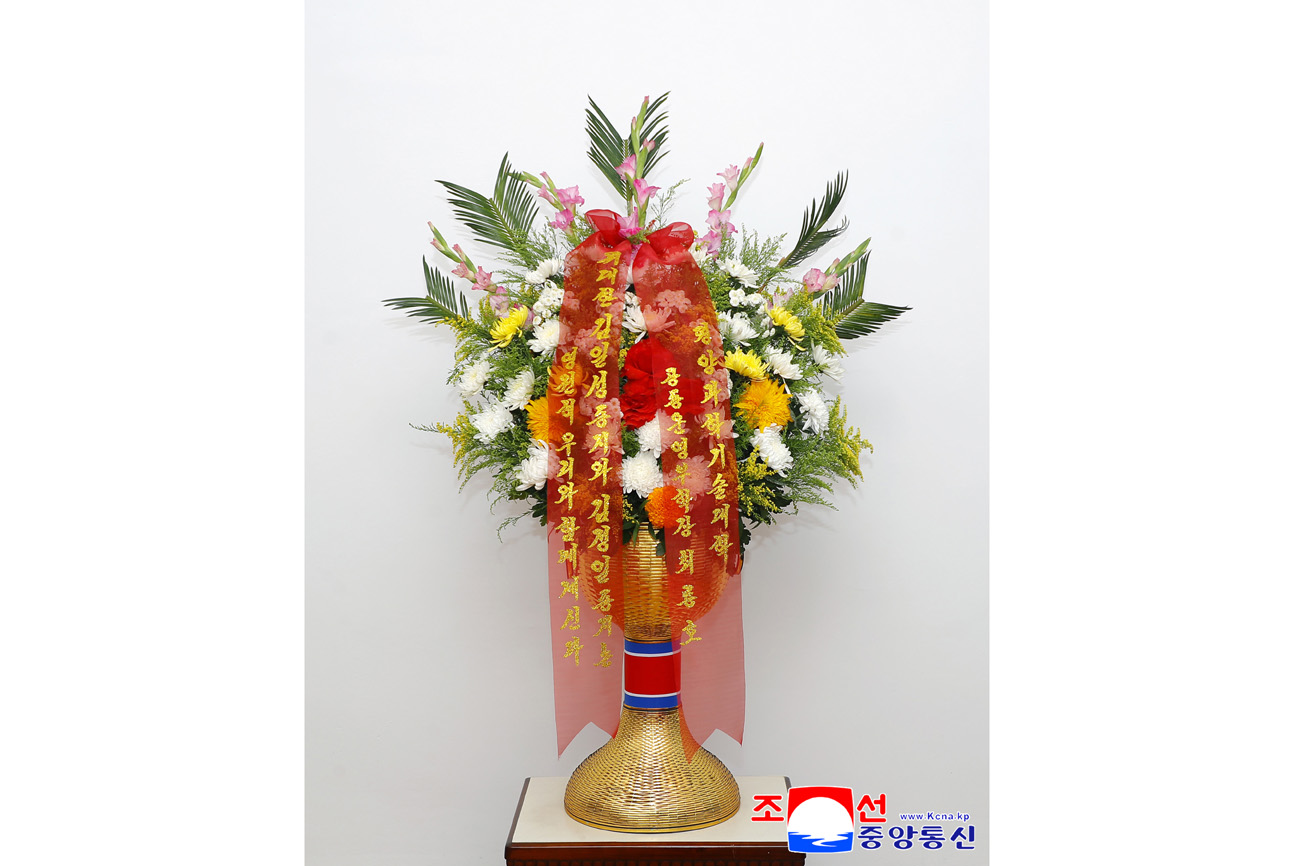 Floral baskets sent to bronze statues of great leaders Kim Il Sung and Kim Jong Il