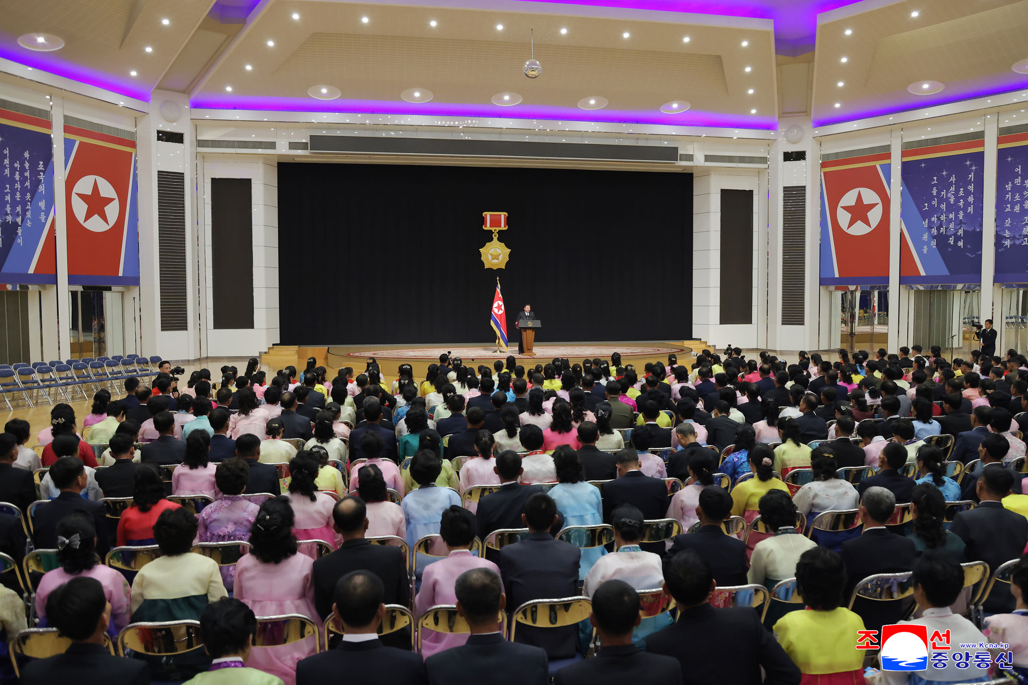 Respected Comrade Kim Jong Un meets bereaved families of martyrs who rendered distinguished services in overseas military operations to console and have photo session with them