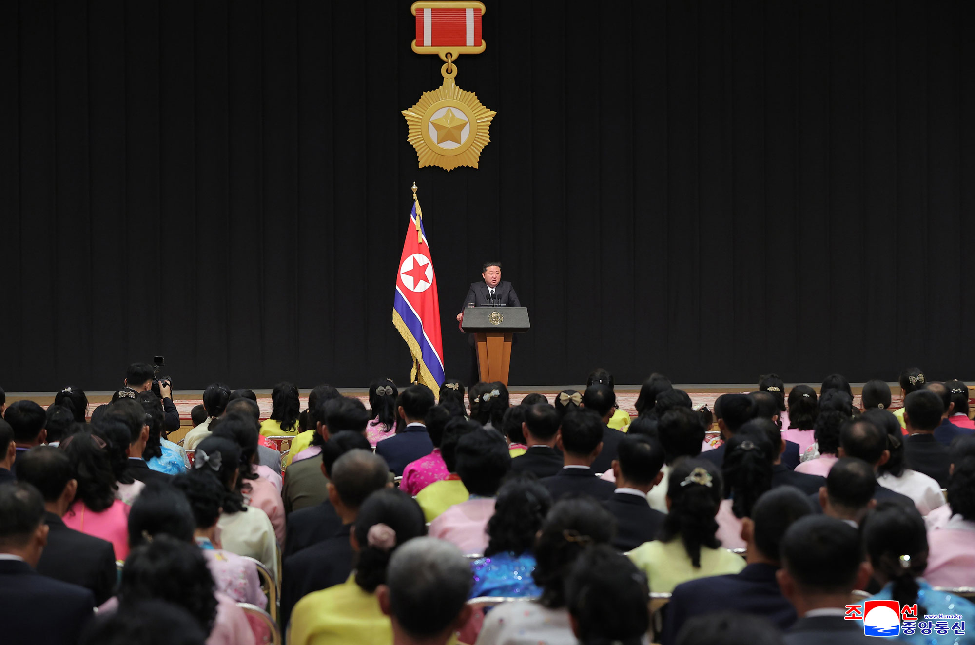 Respected Comrade Kim Jong Un meets bereaved families of martyrs who rendered distinguished services in overseas military operations to console and have photo session with them