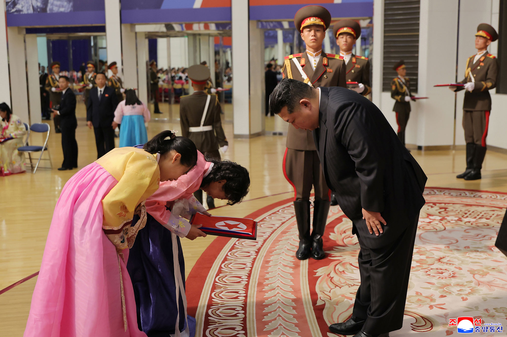 Respected Comrade Kim Jong Un meets bereaved families of martyrs who rendered distinguished services in overseas military operations to console and have photo session with them