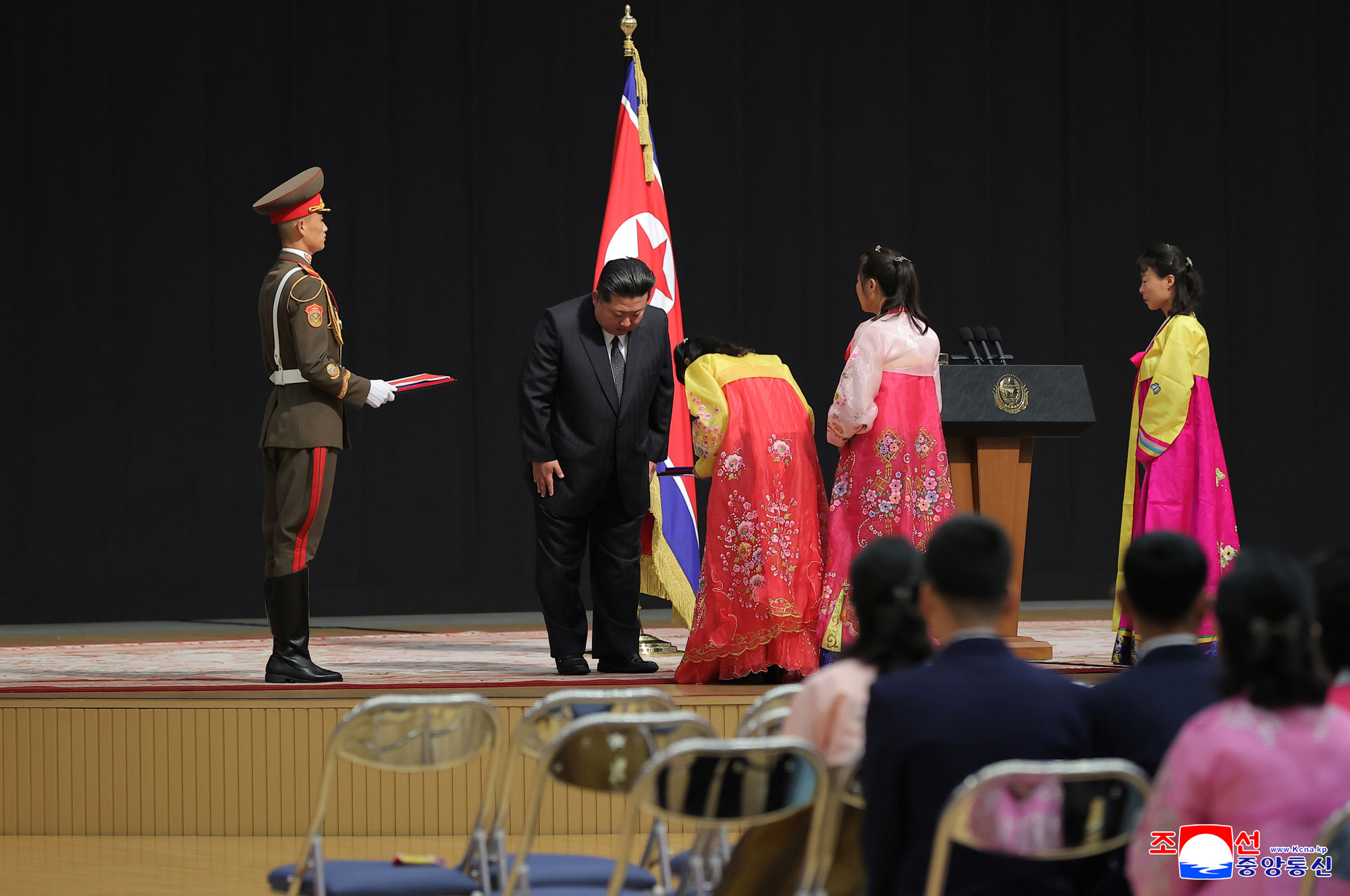Respected Comrade Kim Jong Un meets bereaved families of martyrs who rendered distinguished services in overseas military operations to console and have photo session with them