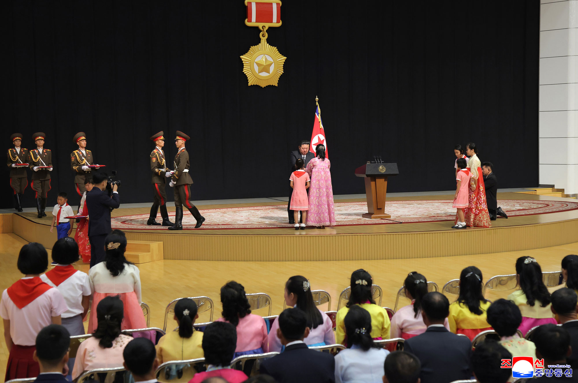 Respected Comrade Kim Jong Un meets bereaved families of martyrs who rendered distinguished services in overseas military operations to console and have photo session with them