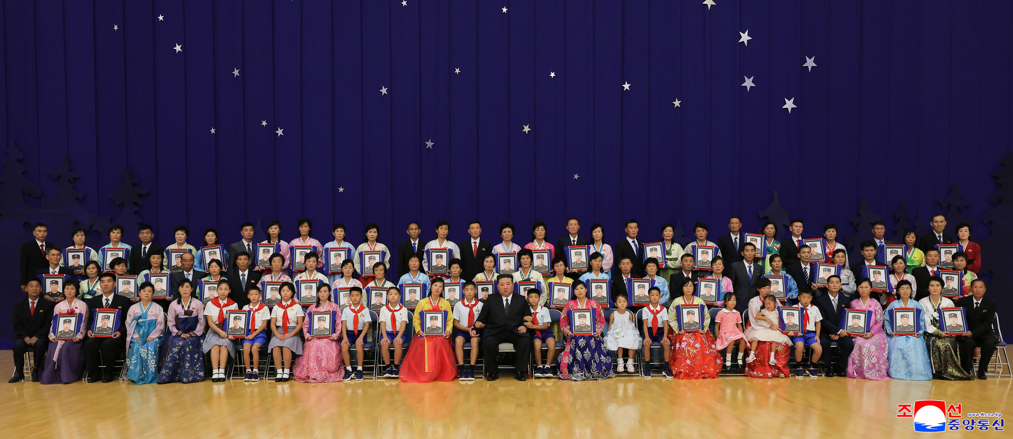 Respected Comrade Kim Jong Un meets bereaved families of martyrs who rendered distinguished services in overseas military operations to console and have photo session with them