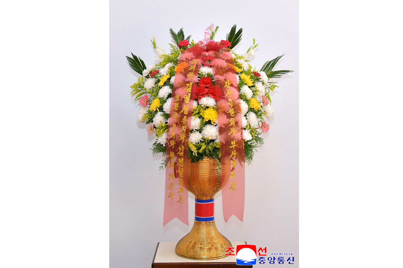 Floral baskets sent to bronze statues of great leaders Kim Il Sung and Kim Jong Il by Koreans in China