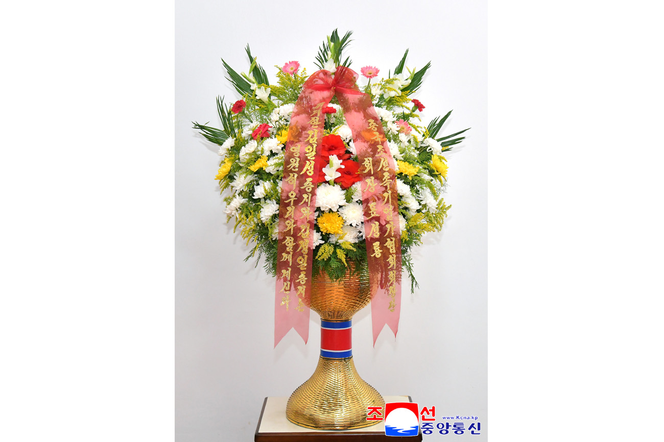Floral baskets sent to bronze statues of great leaders Kim Il Sung and Kim Jong Il by Koreans in China