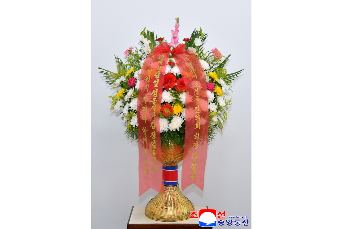 Floral baskets sent to bronze statues of great leaders Kim Il Sung and Kim Jong Il by Koreans in China