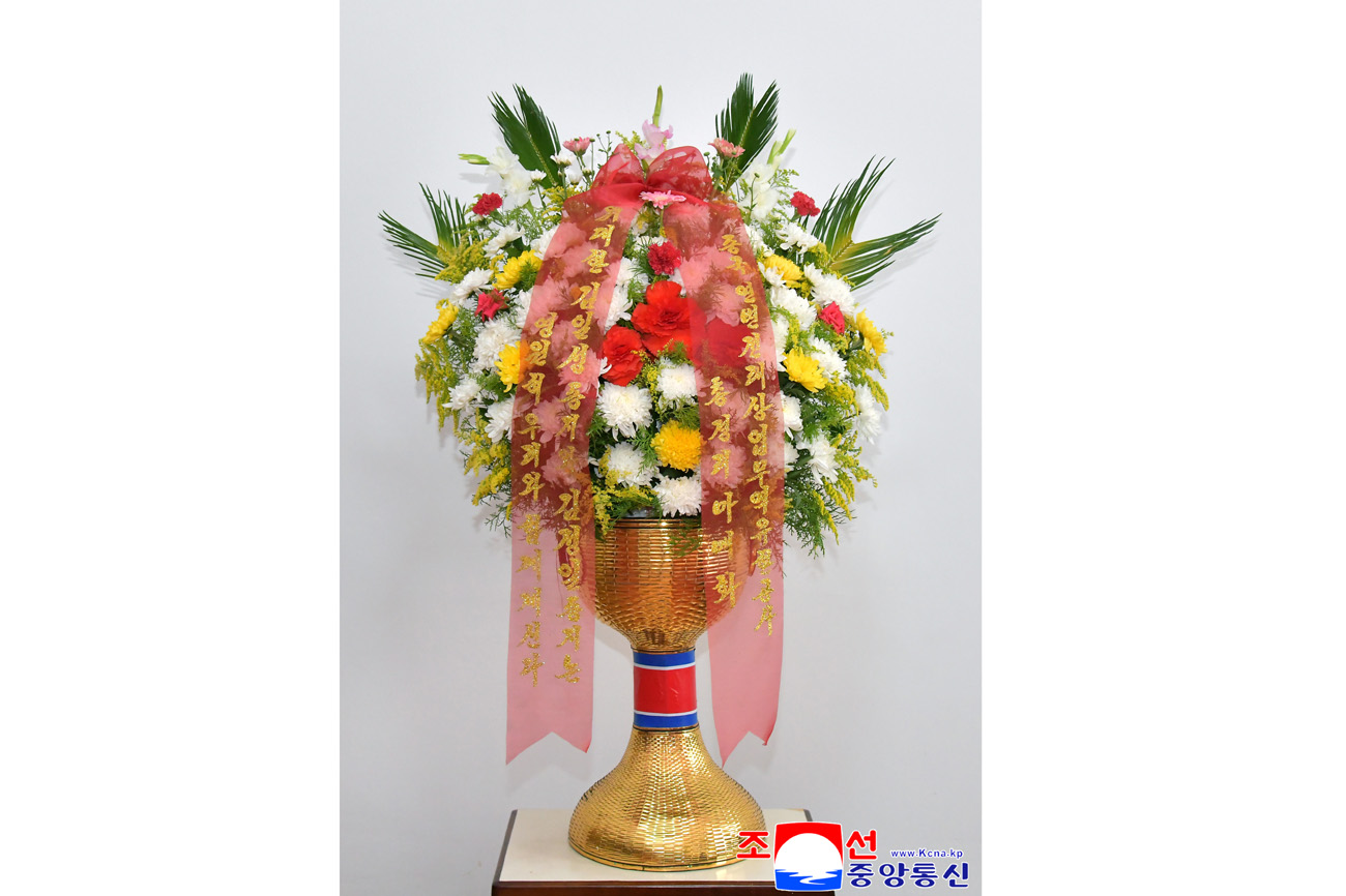 Floral baskets sent to bronze statues of great leaders Kim Il Sung and Kim Jong Il by Koreans in China