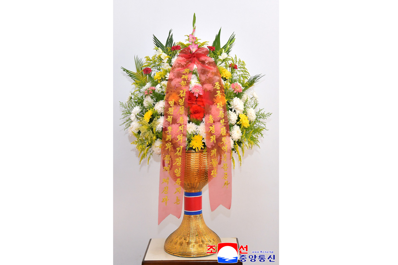 Floral baskets sent to bronze statues of great leaders Kim Il Sung and Kim Jong Il by Koreans in China
