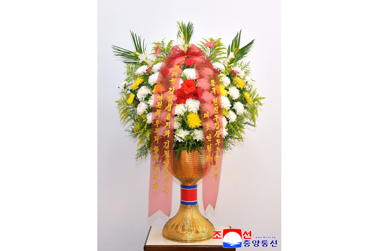 Floral baskets sent to bronze statues of great leaders Kim Il Sung and Kim Jong Il by Koreans in China