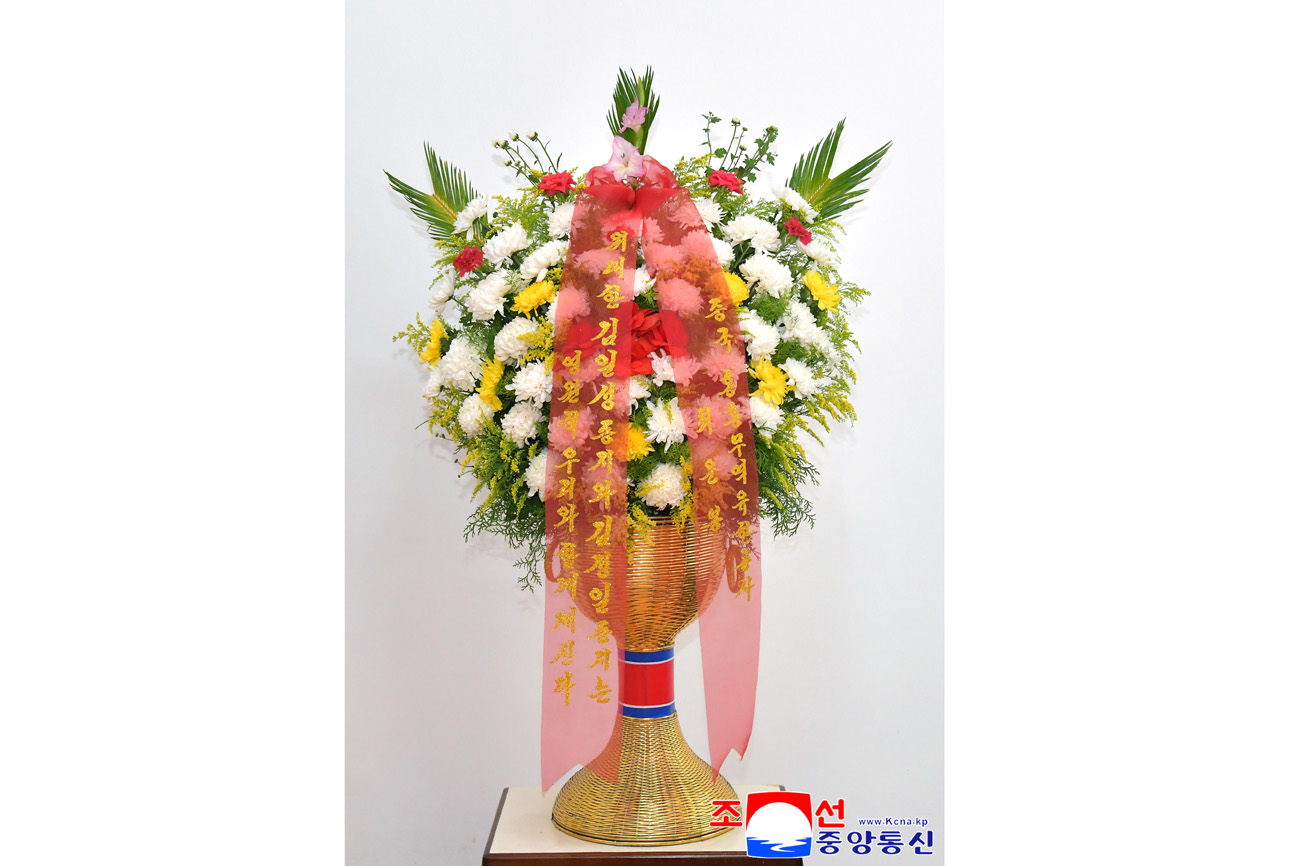 Floral baskets sent to bronze statues of great leaders Kim Il Sung and Kim Jong Il by Koreans in China