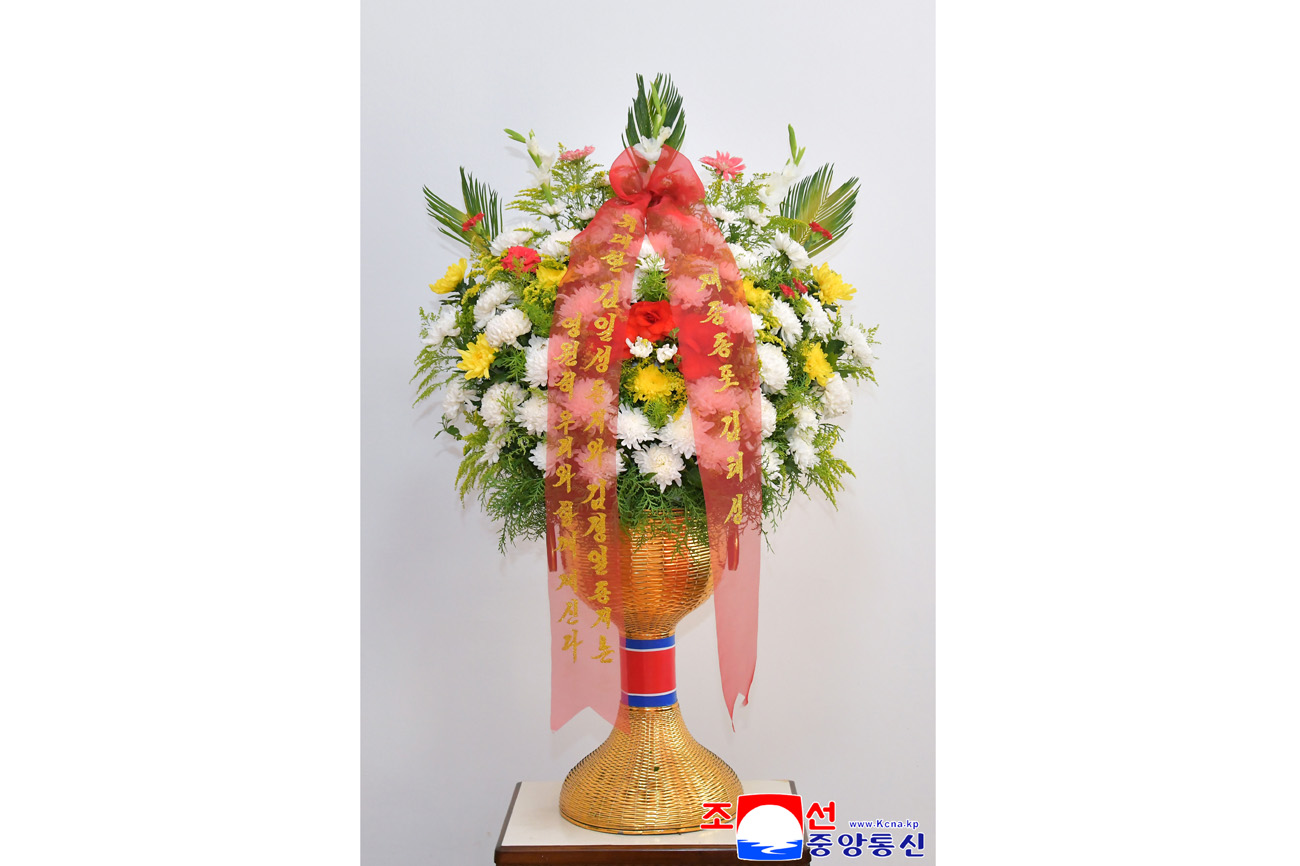 Floral baskets sent to bronze statues of great leaders Kim Il Sung and Kim Jong Il by Koreans in China