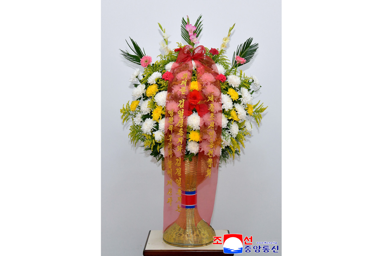 Floral baskets to bronze statues of great leaders Kim Il Sung and Kim Jong Il from overseas Koreans