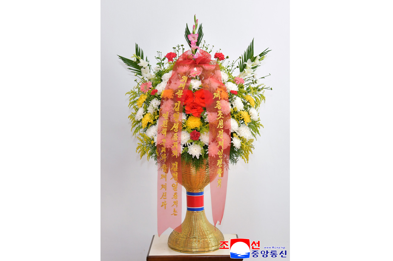Floral baskets to bronze statues of great leaders Kim Il Sung and Kim Jong Il from overseas Koreans