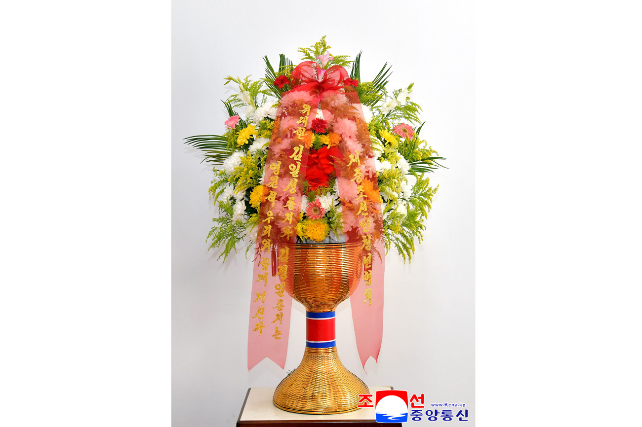 Floral baskets to bronze statues of great leaders Kim Il Sung and Kim Jong Il from overseas Koreans
