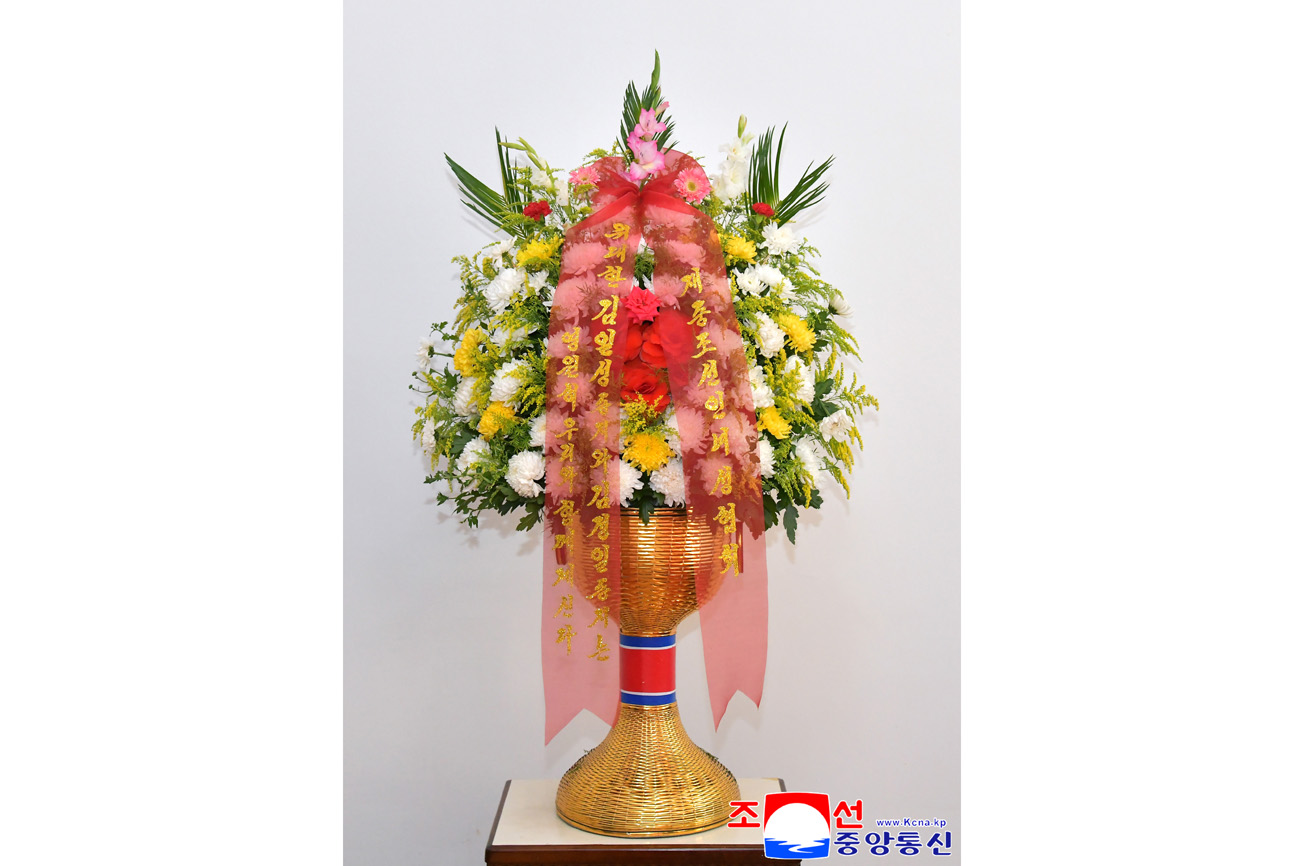 Floral baskets to bronze statues of great leaders Kim Il Sung and Kim Jong Il from overseas Koreans