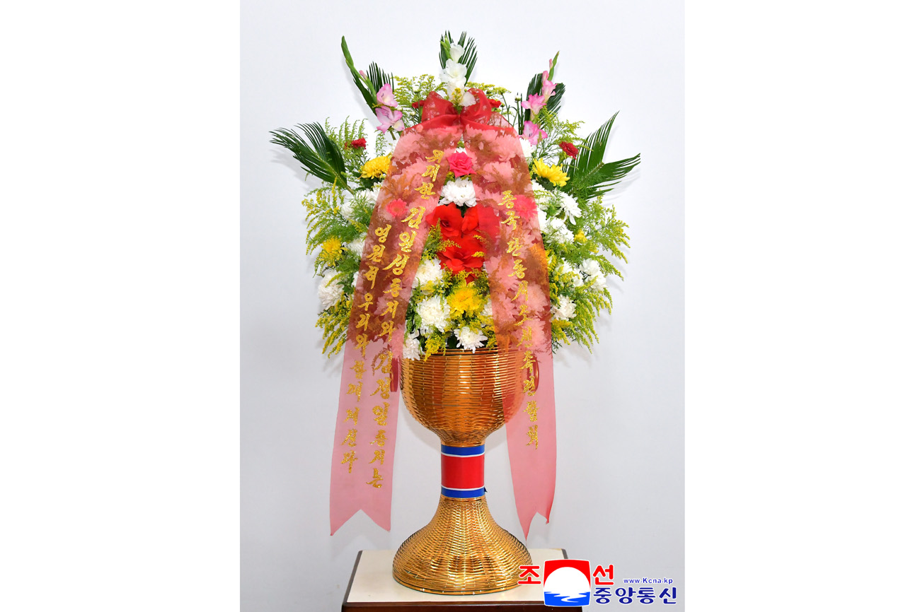 Floral baskets to bronze statues of great leaders Kim Il Sung and Kim Jong Il from overseas Koreans
