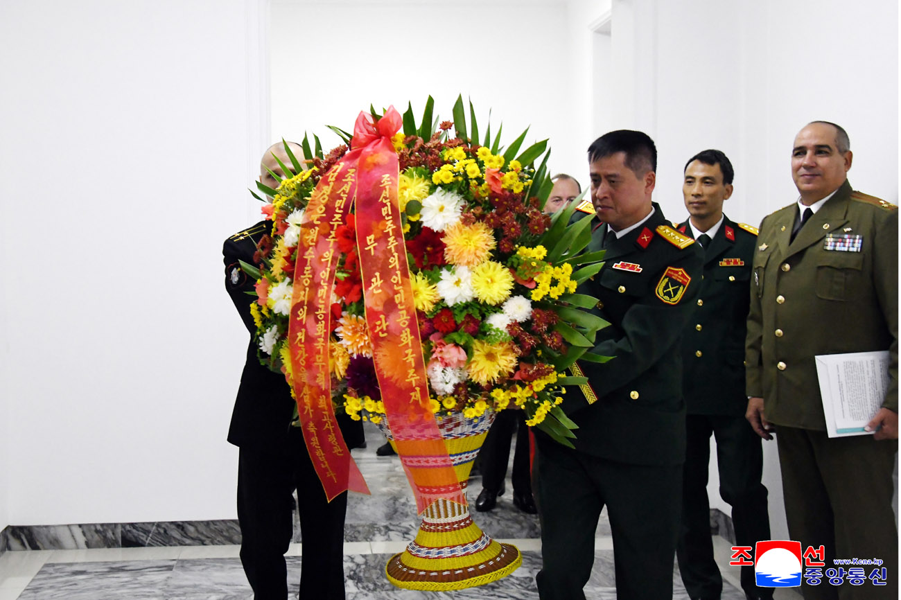 Floral basket and letter to respected Comrade Kim Jong Un from foreign military attaches
