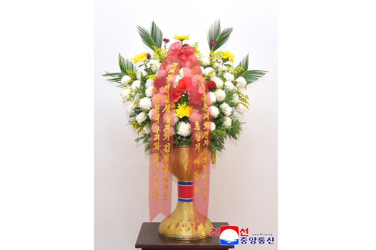 Floral baskets sent to bronze statues of great leaders Kim Il Sung and Kim Jong Il