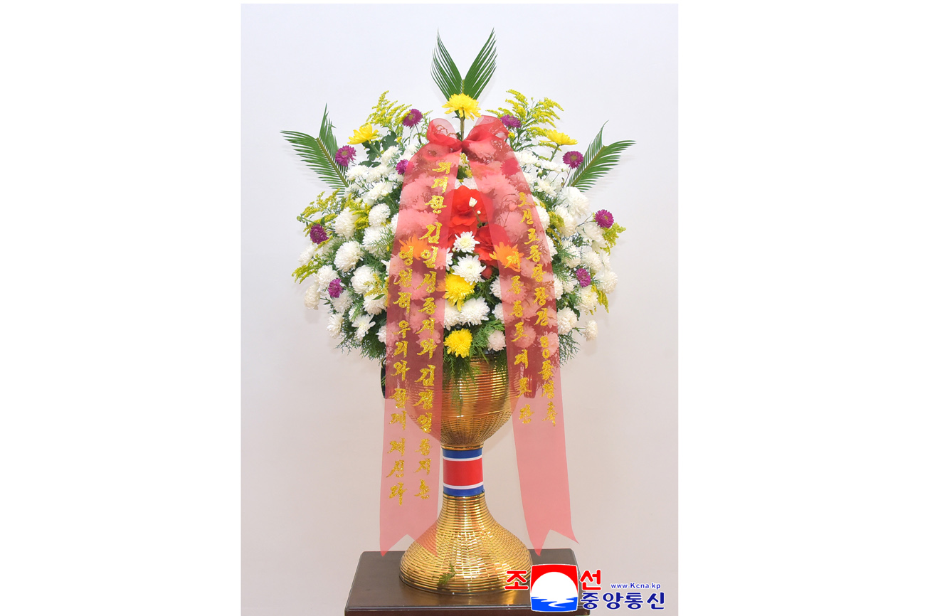 Floral baskets sent to bronze statues of great leaders Kim Il Sung and Kim Jong Il